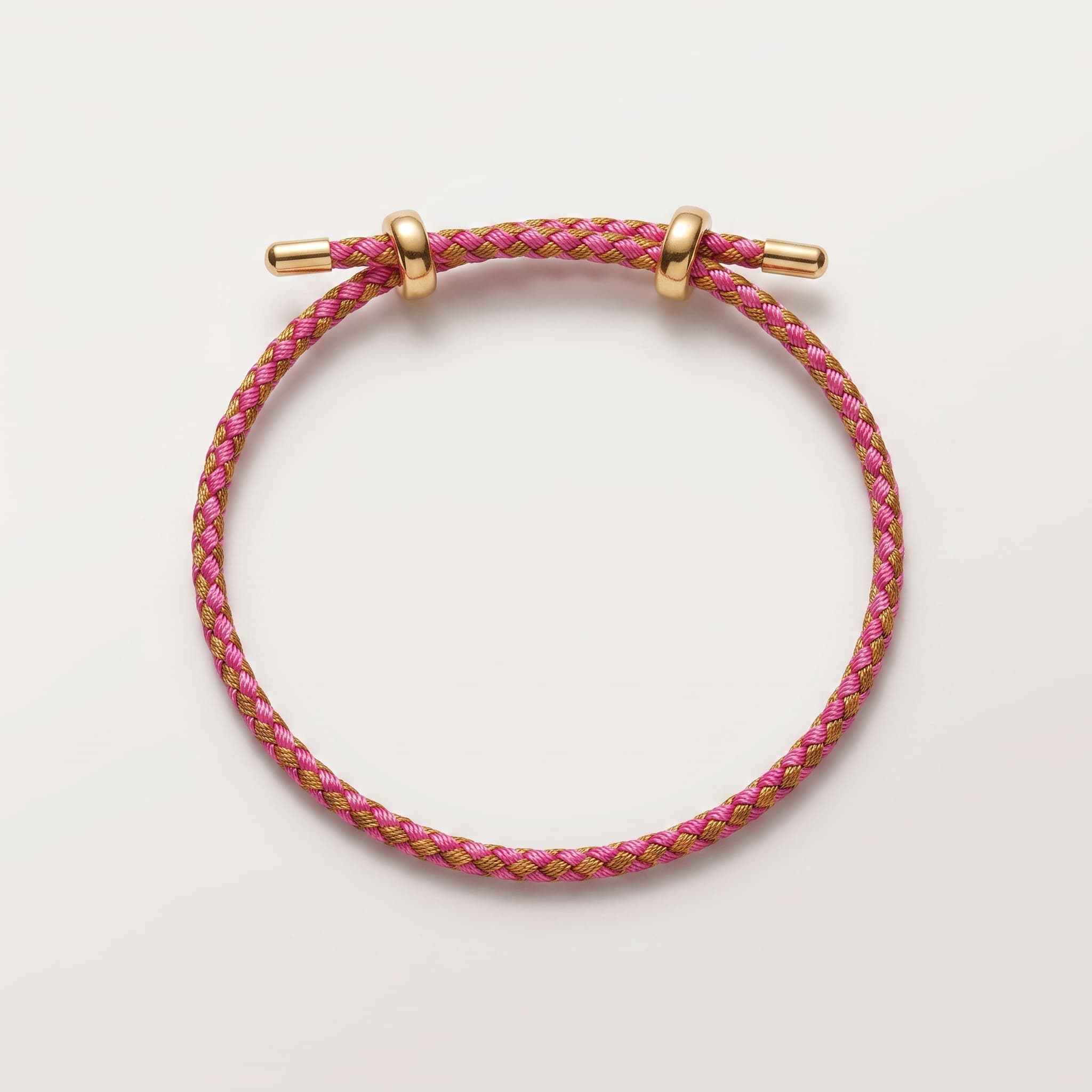 pink and gold woven bracelet