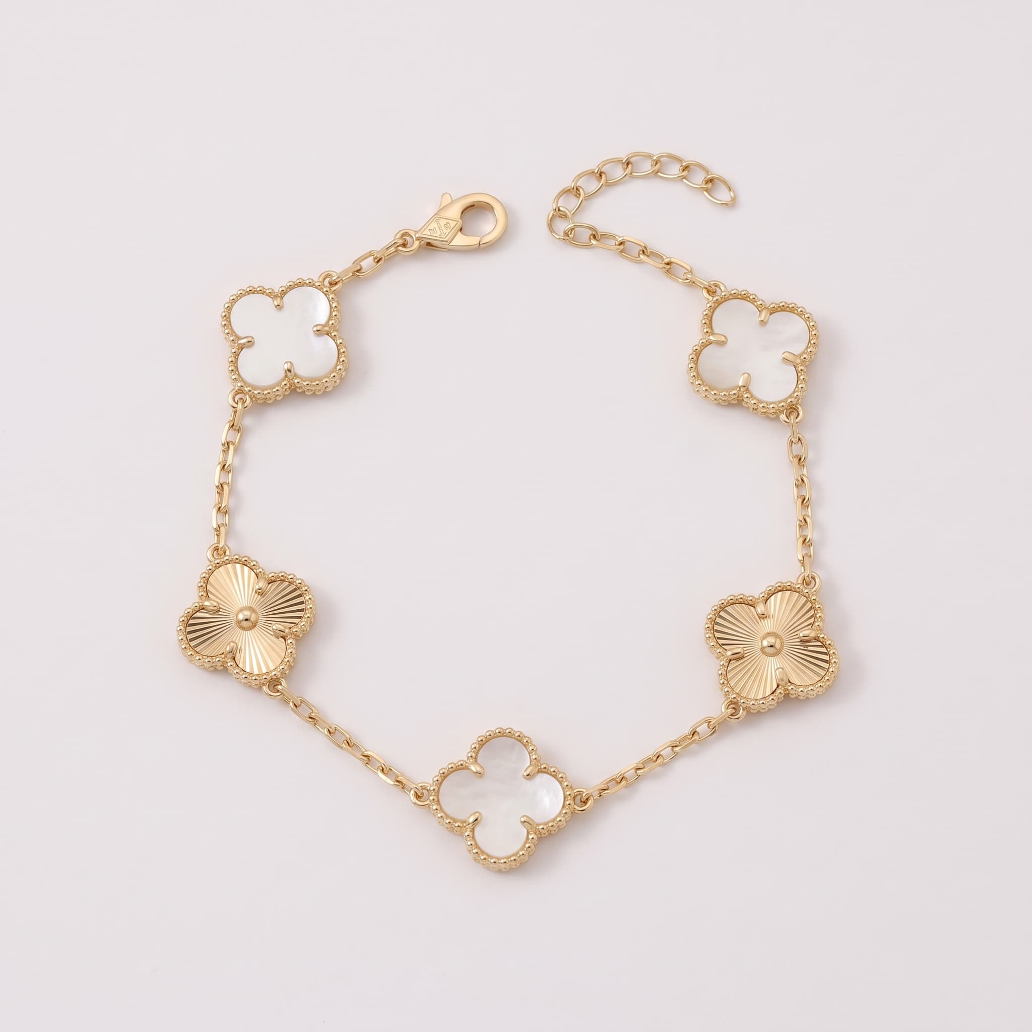 White and gold clover charm bracelet