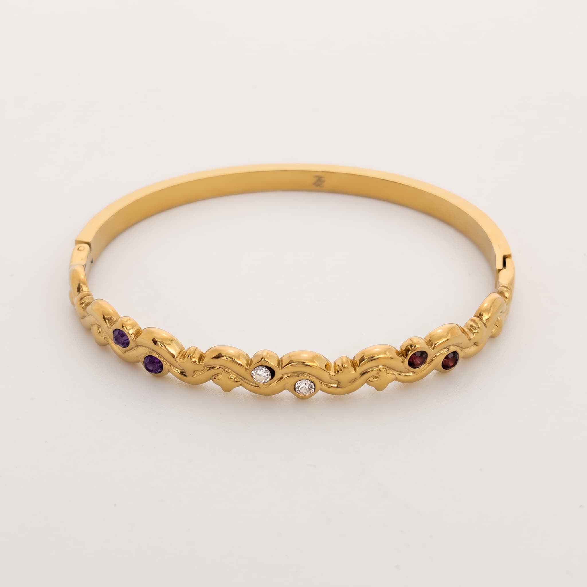 wavy multi stone gold bangle