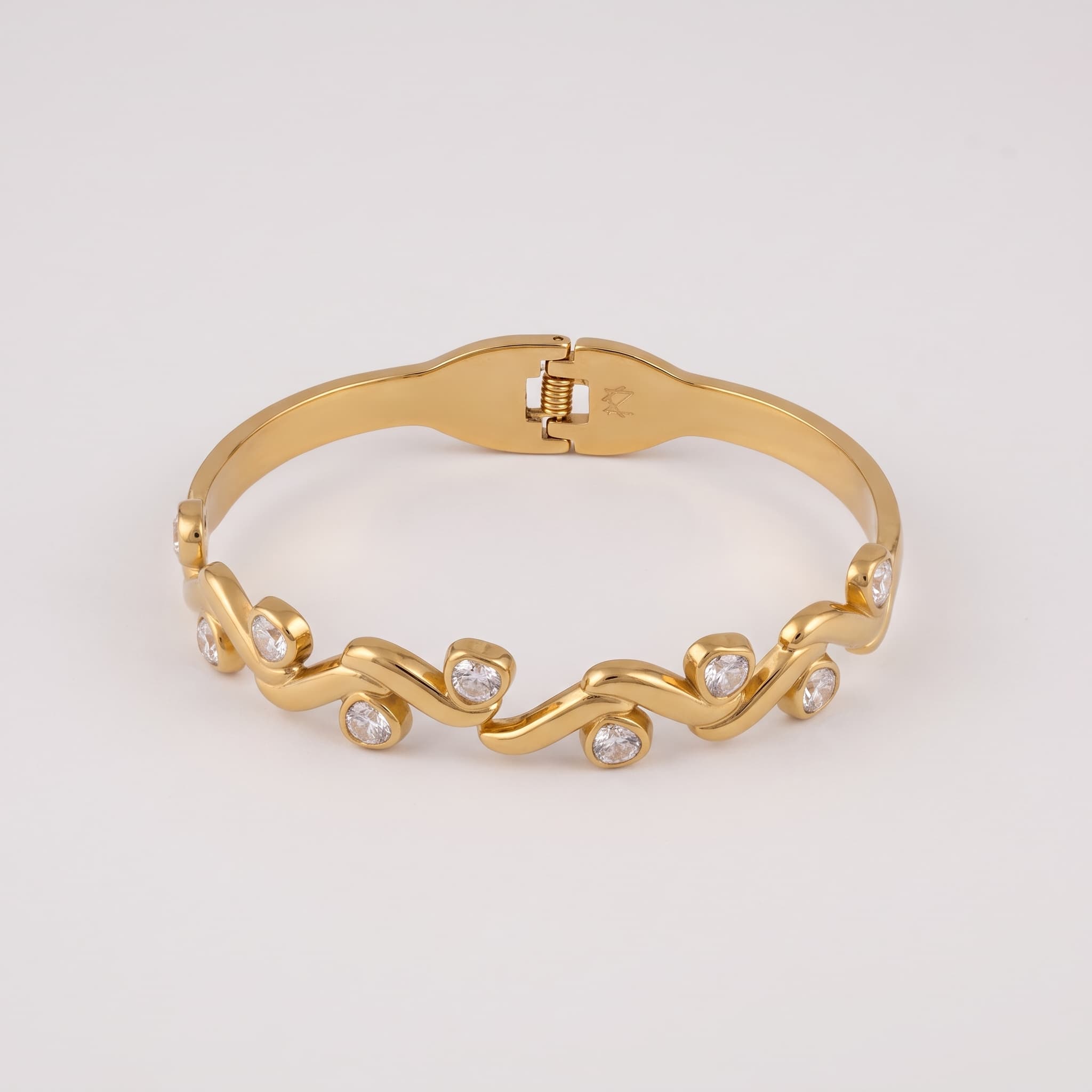 golden swirl stone cuff
