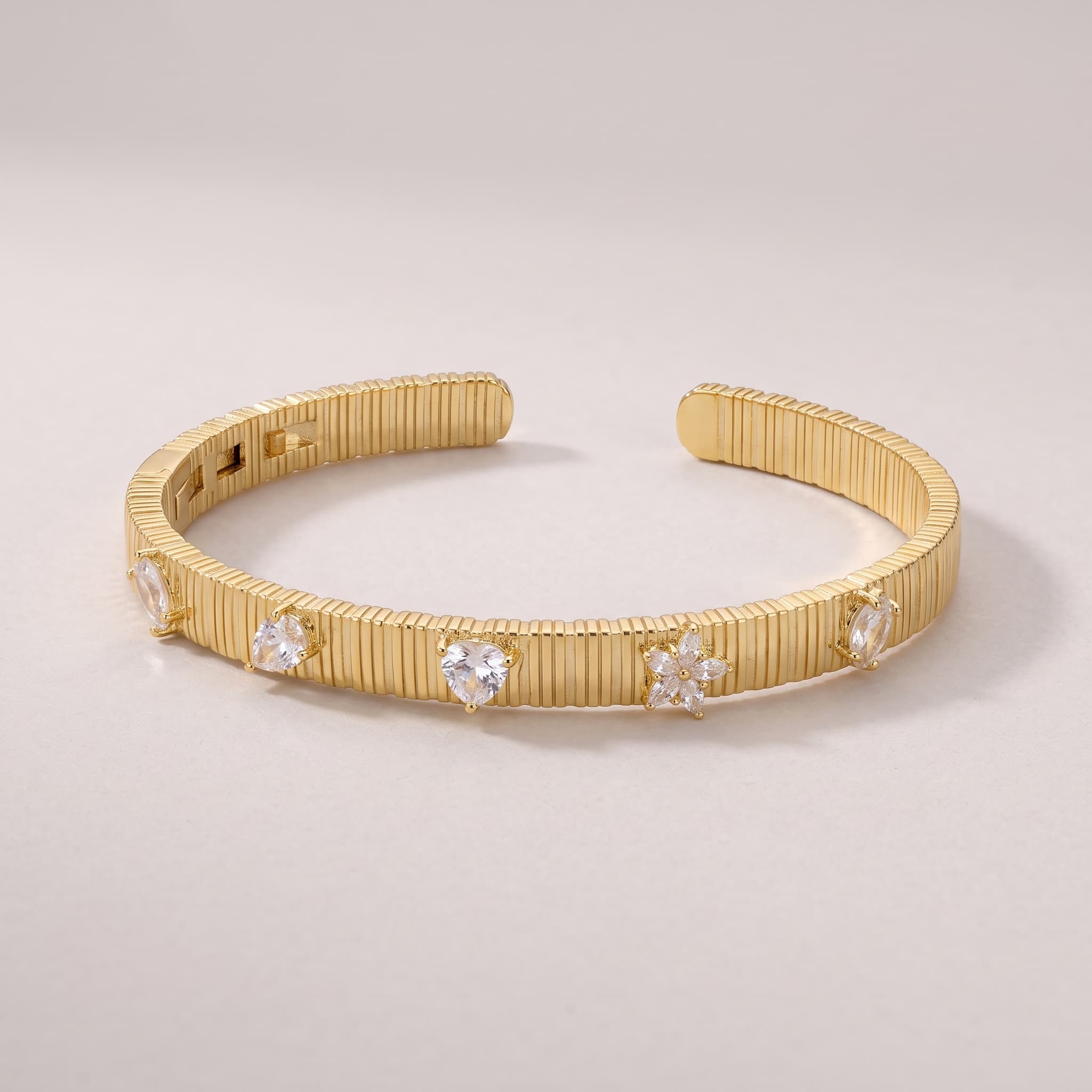 ribbed gold cuff with stones