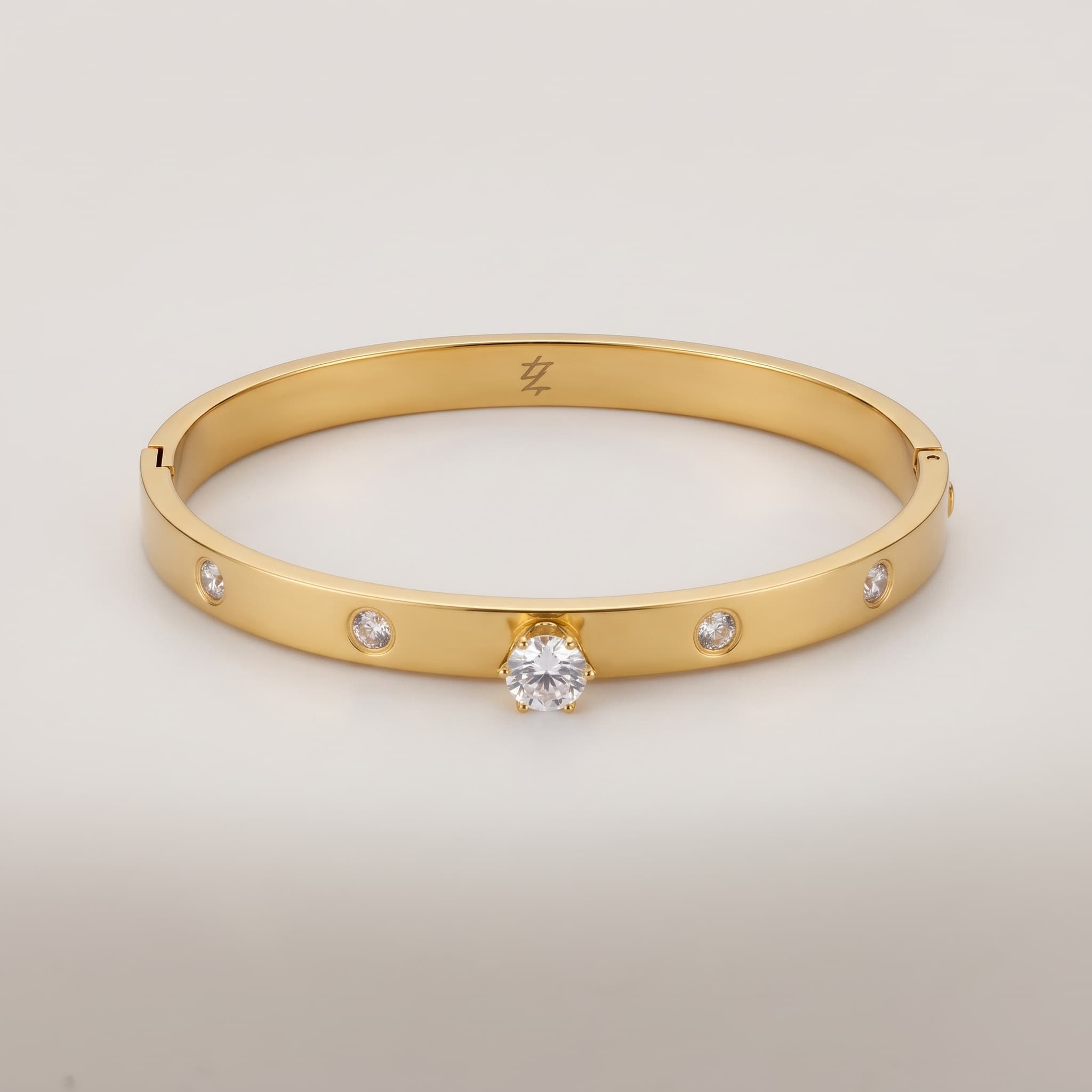 Multi stone studded gold bangle