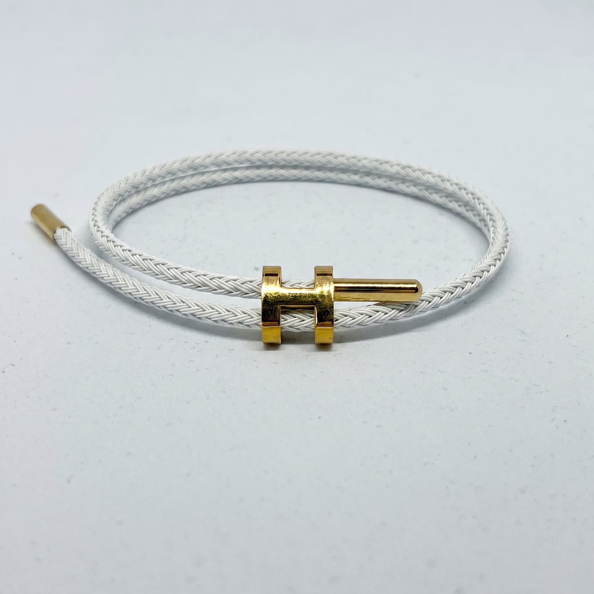 white braided cord bracelet