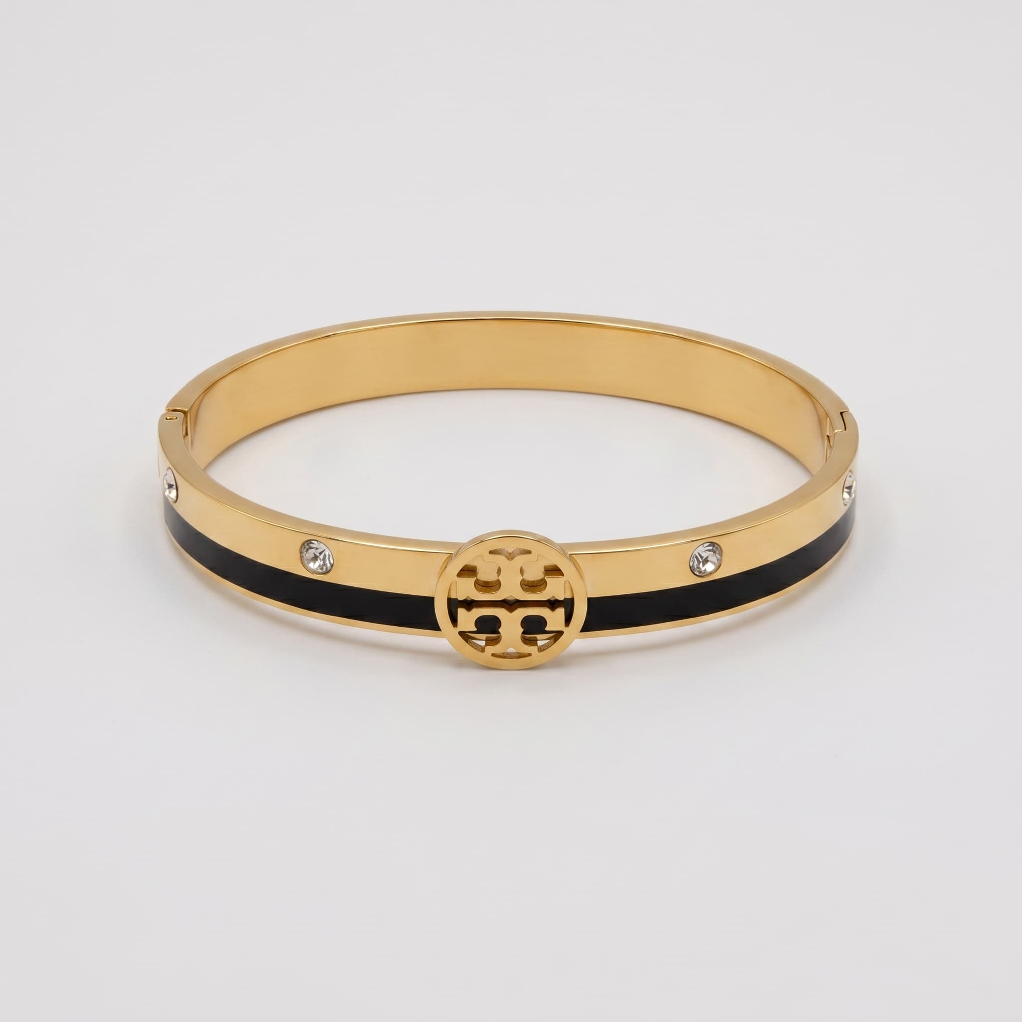 gold and black logo cuff