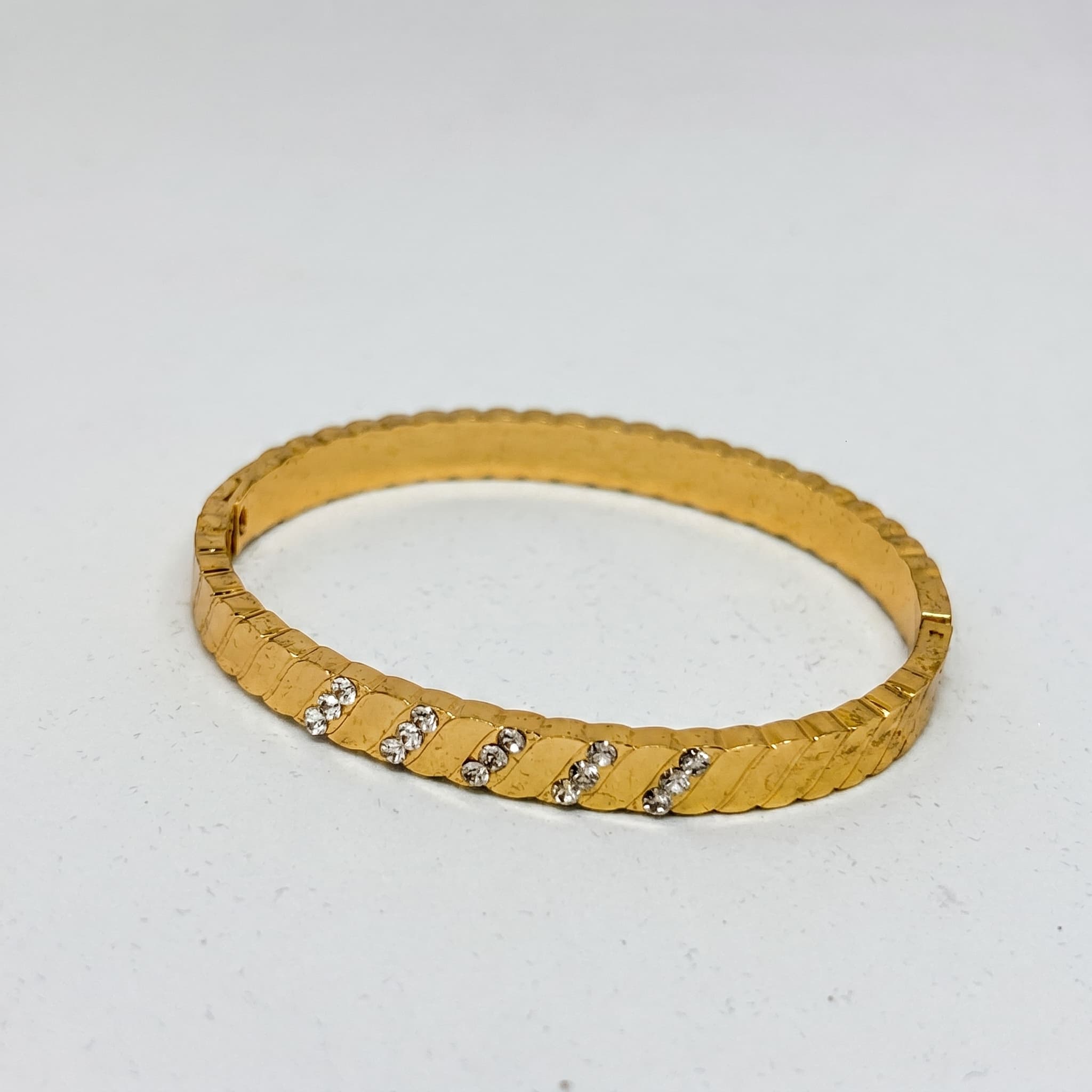 textured stone studded gold bangle