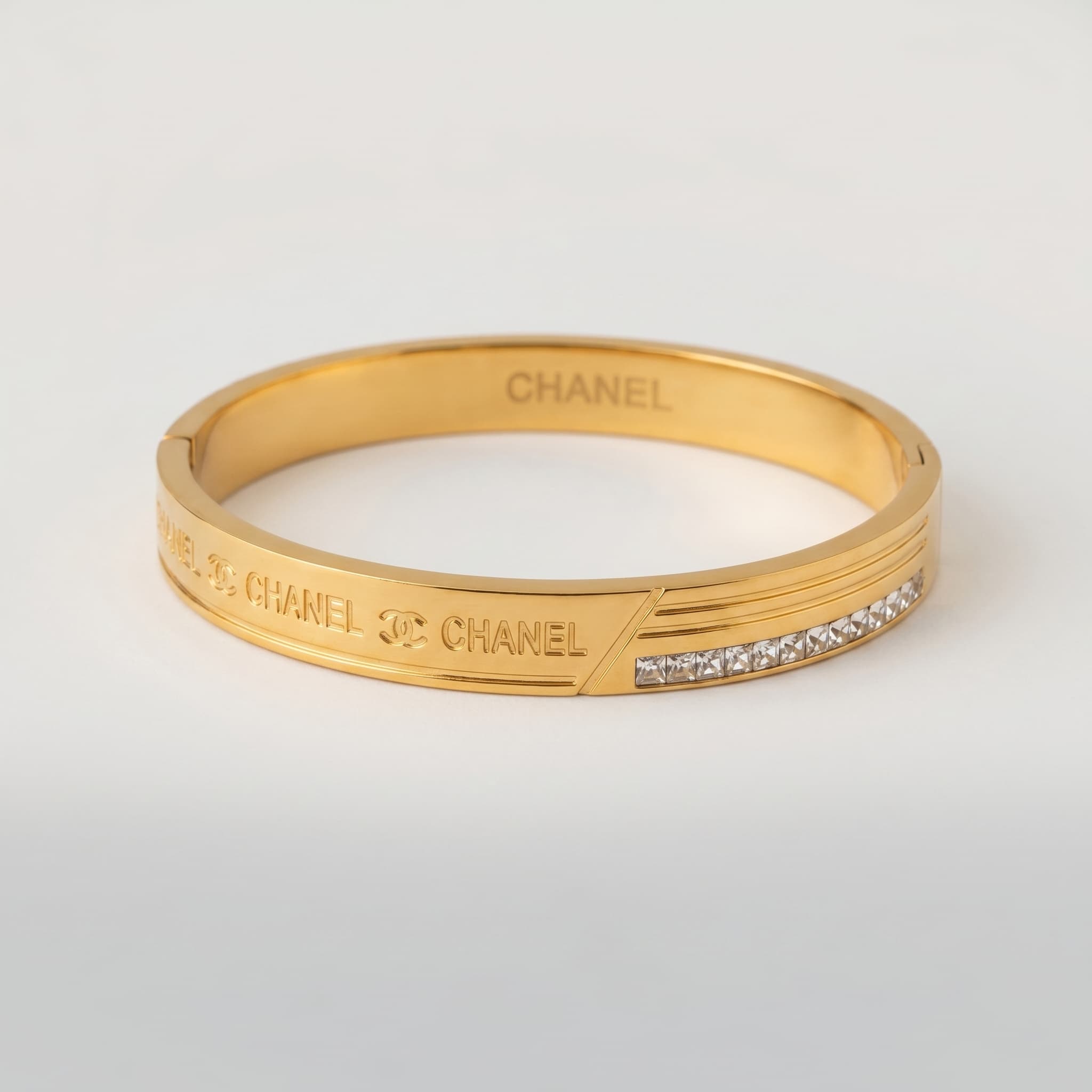 sleek gold logo cuff