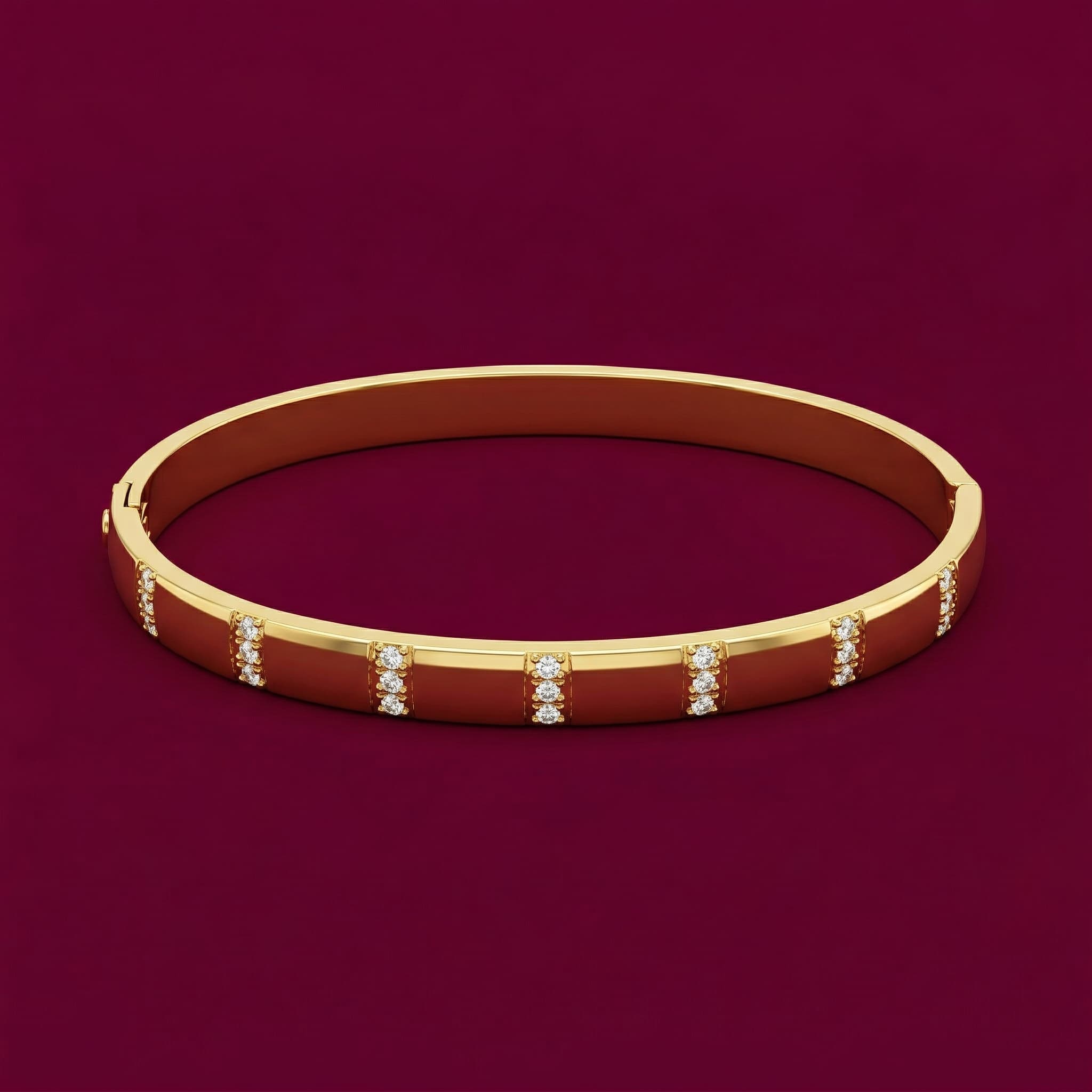 sleek stone-studded gold bangle