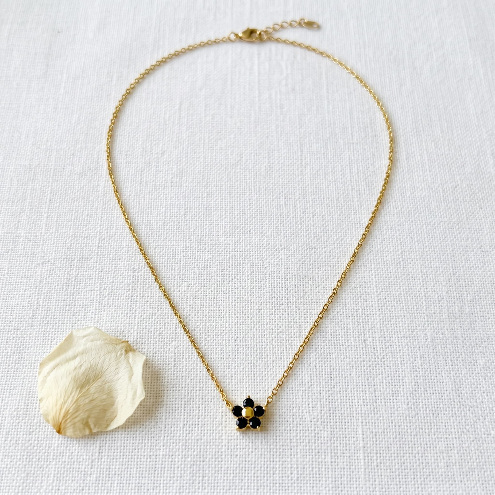 tiny black flower pendant necklace