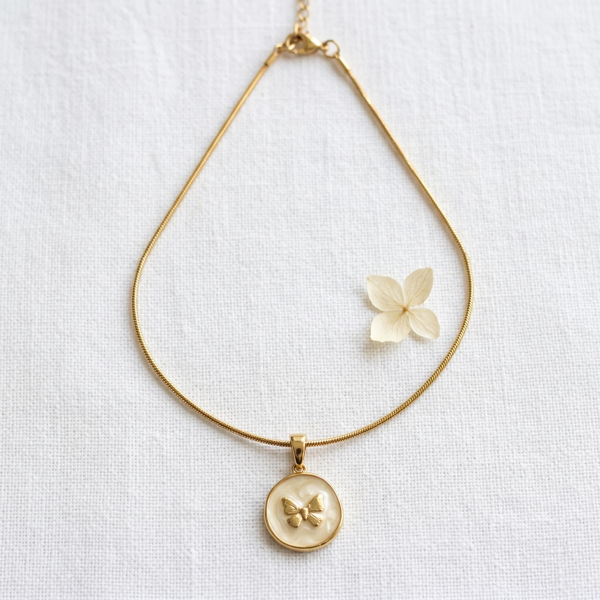 golden butterfly coin pendant