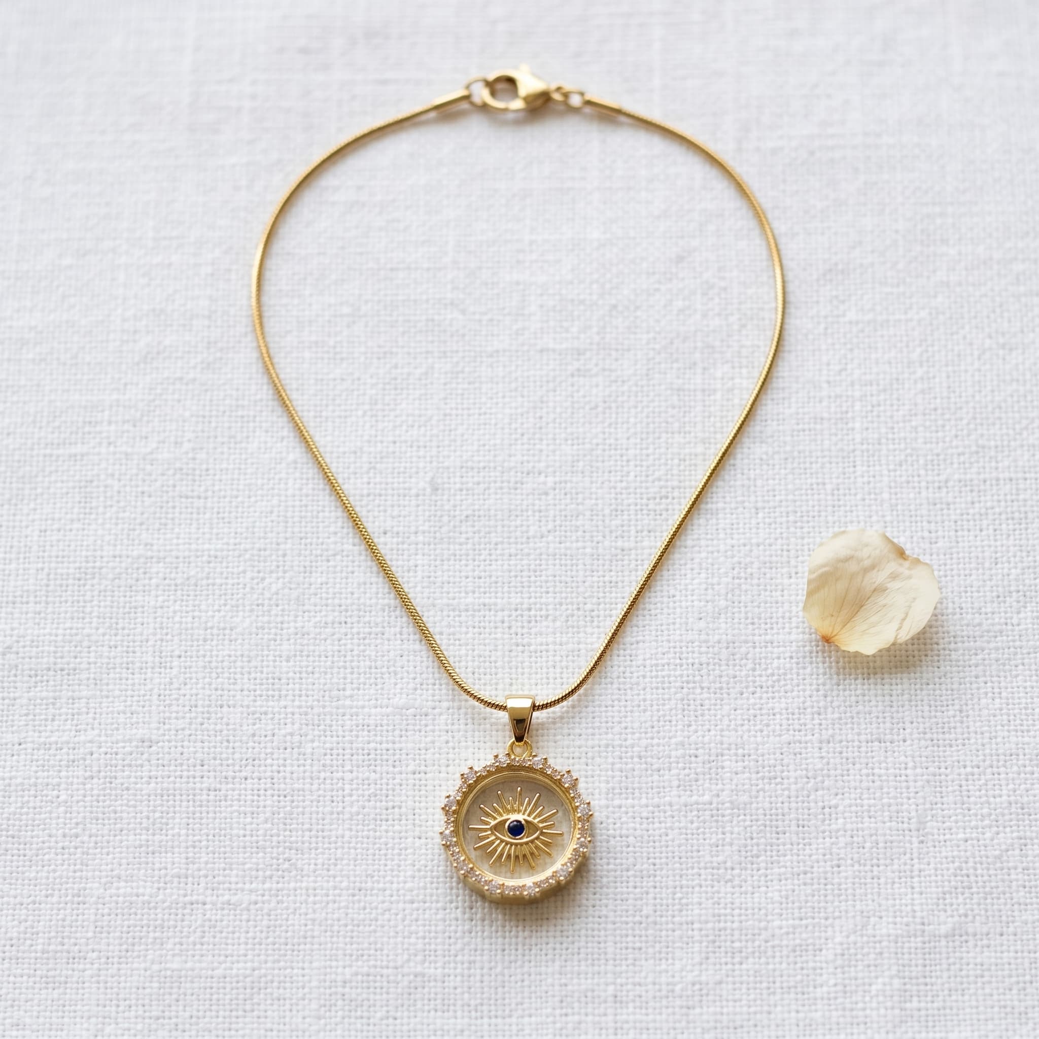 sunburst crystal eye pendant