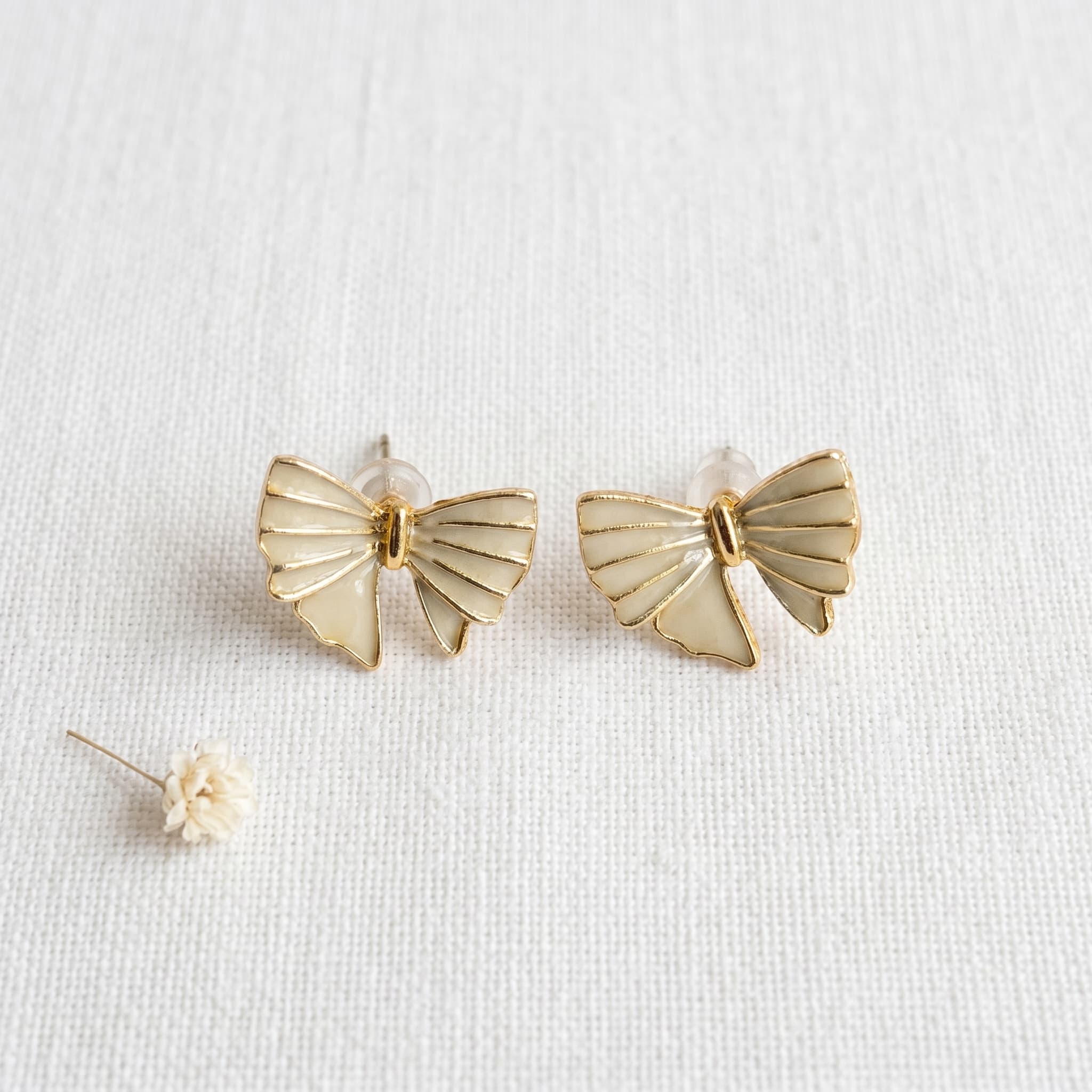 tiny cream bow studs