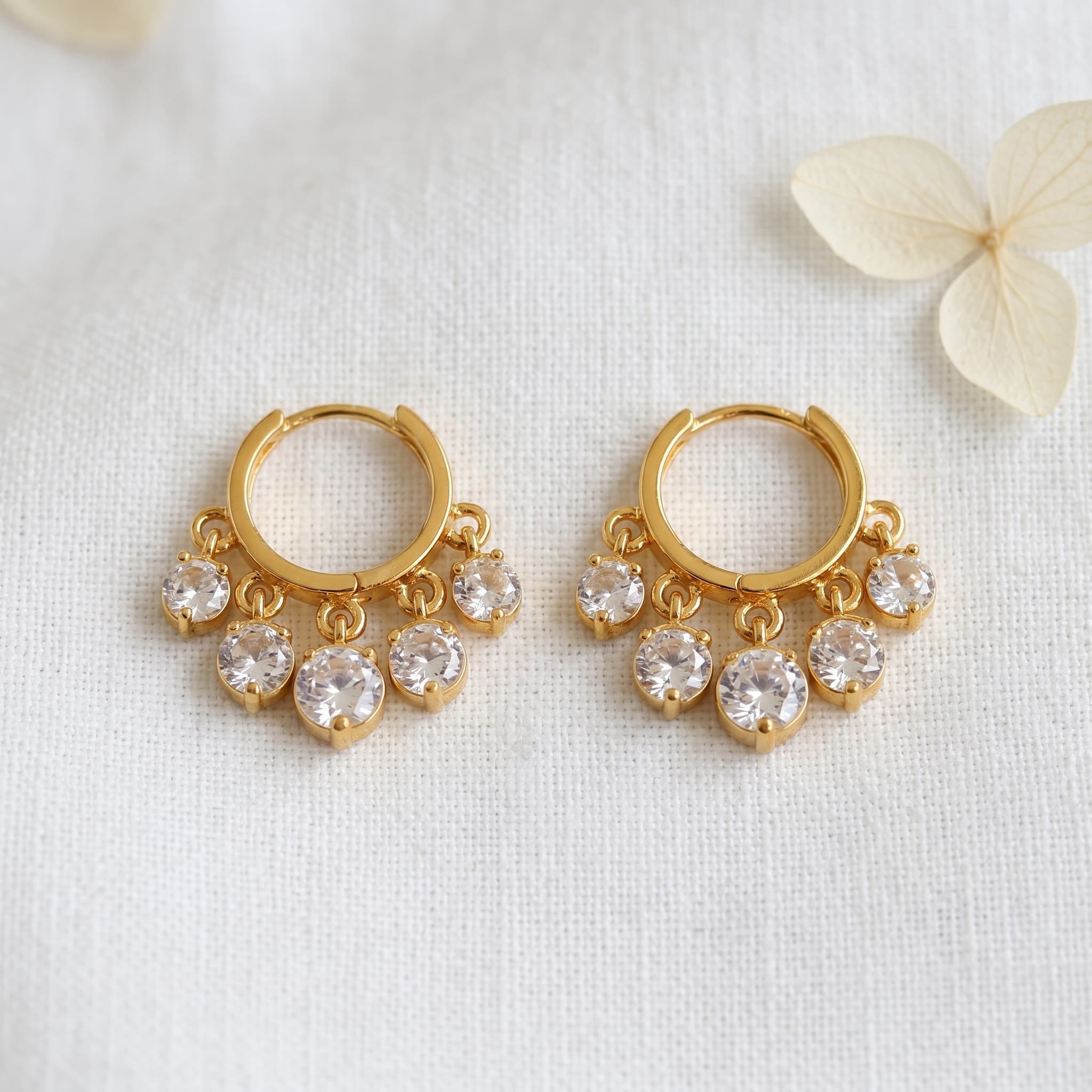 dangling stone gold huggies