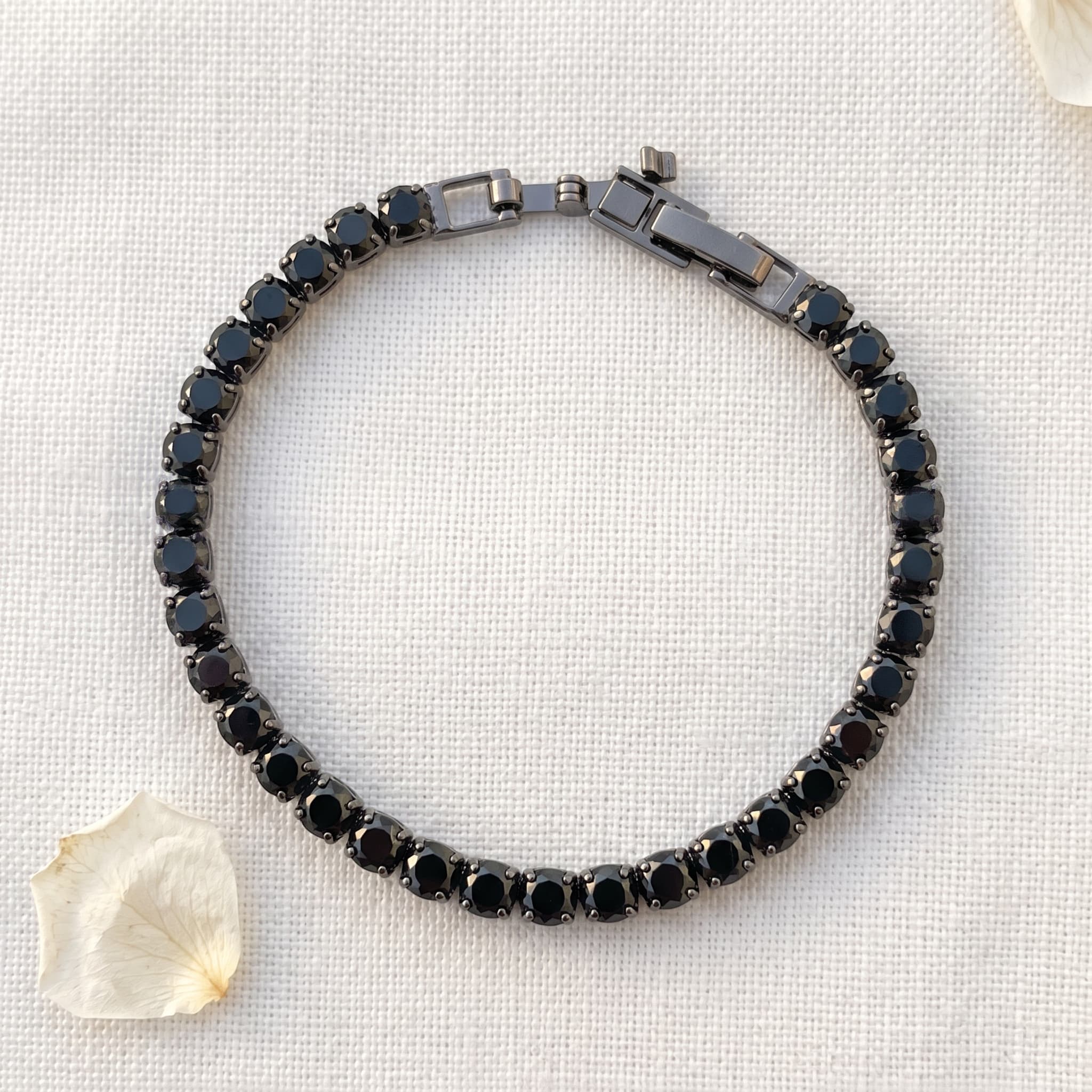 sleek black stone tennis bracelet