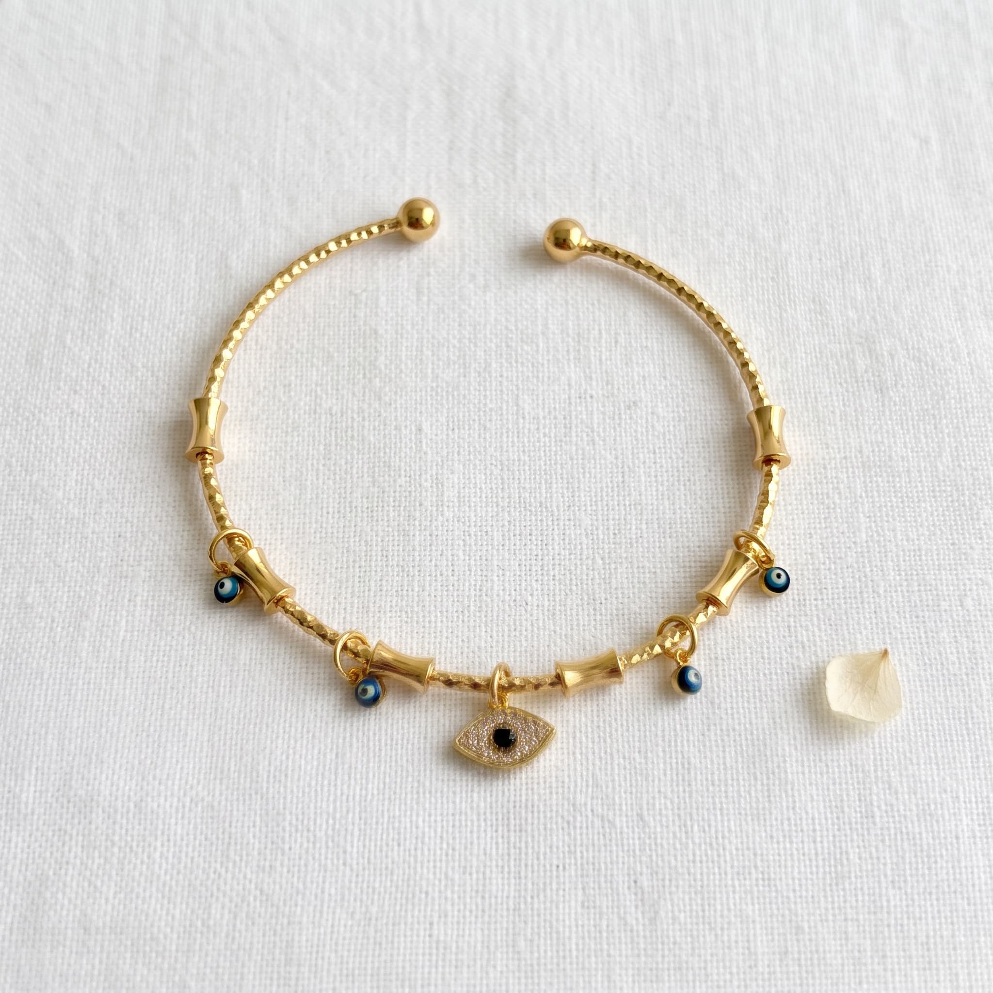 golden evil eye charm cuff
