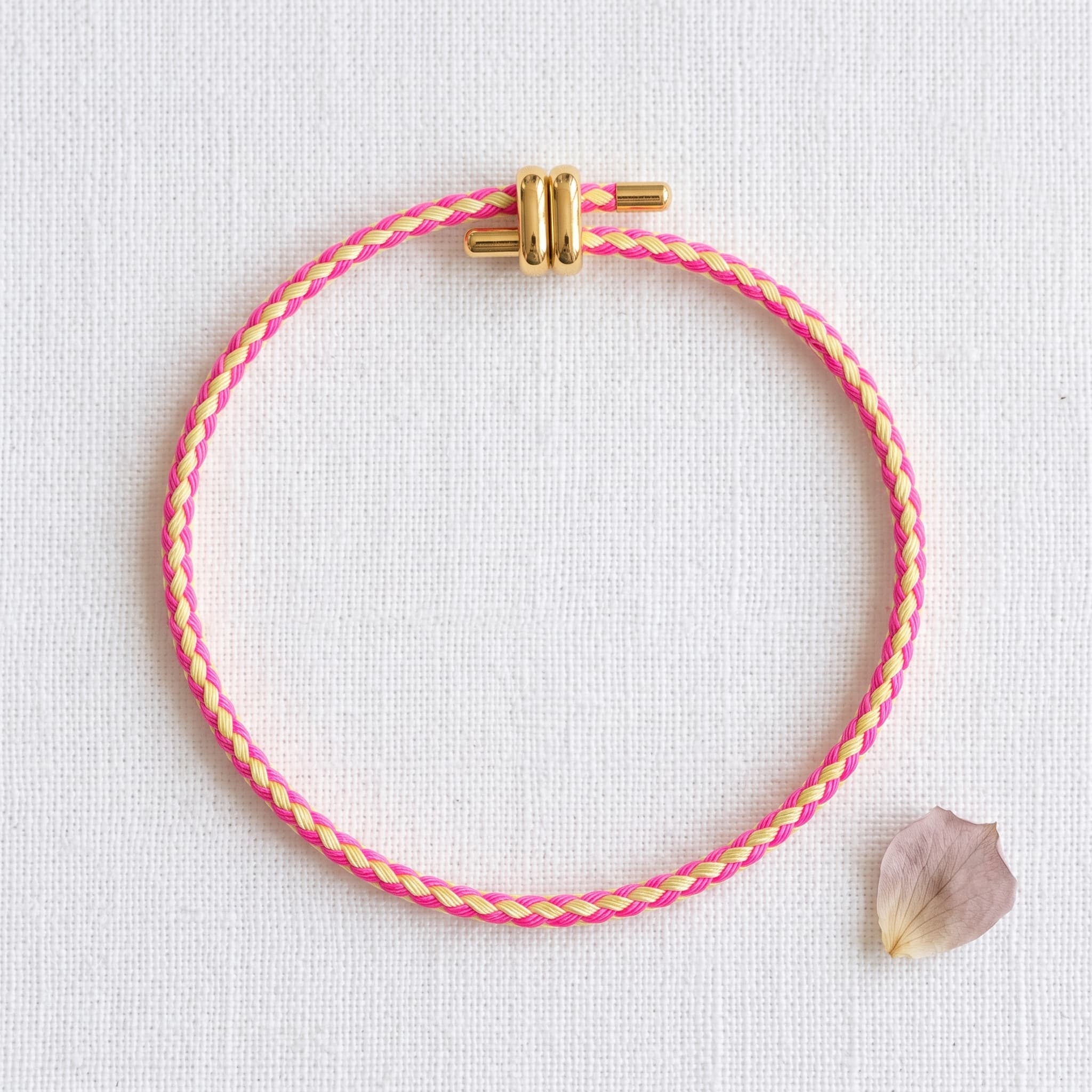 pink and yellow braided bracelet