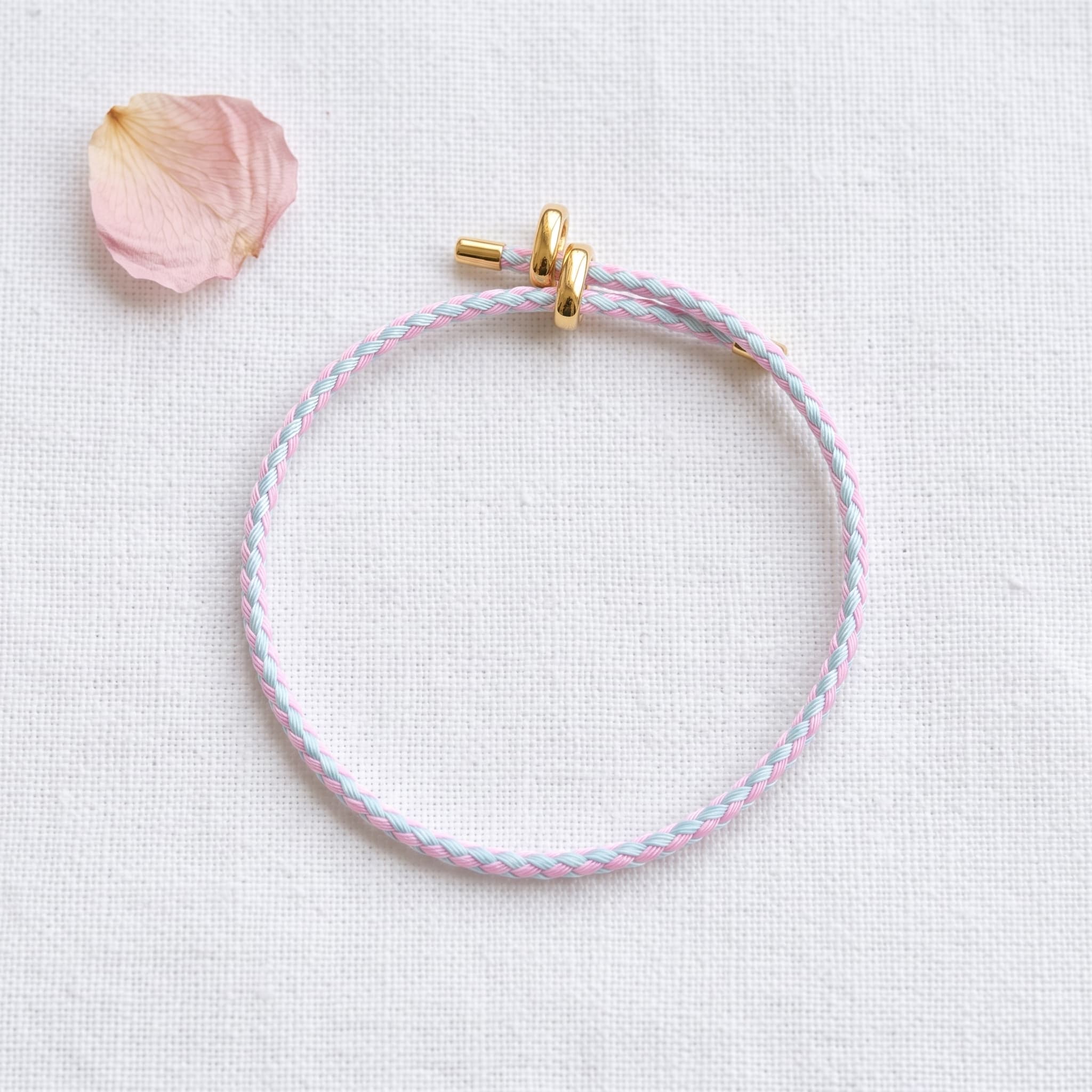 pink and blue braided charm bracelet
