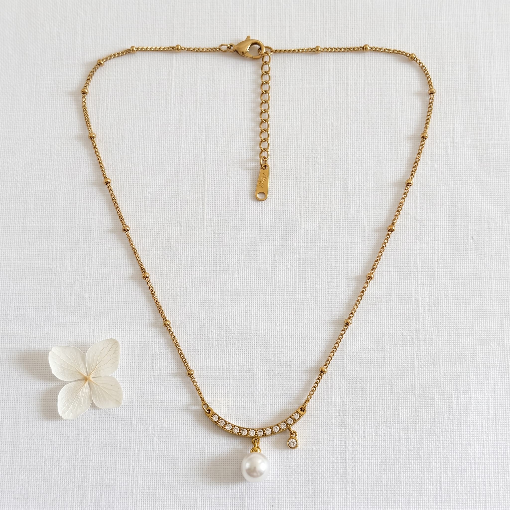 pearl and crystal arc necklace