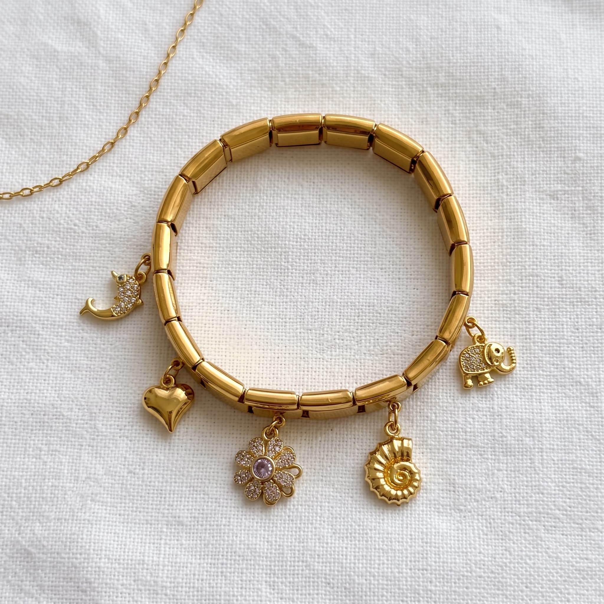 gold multi charm link bracelet