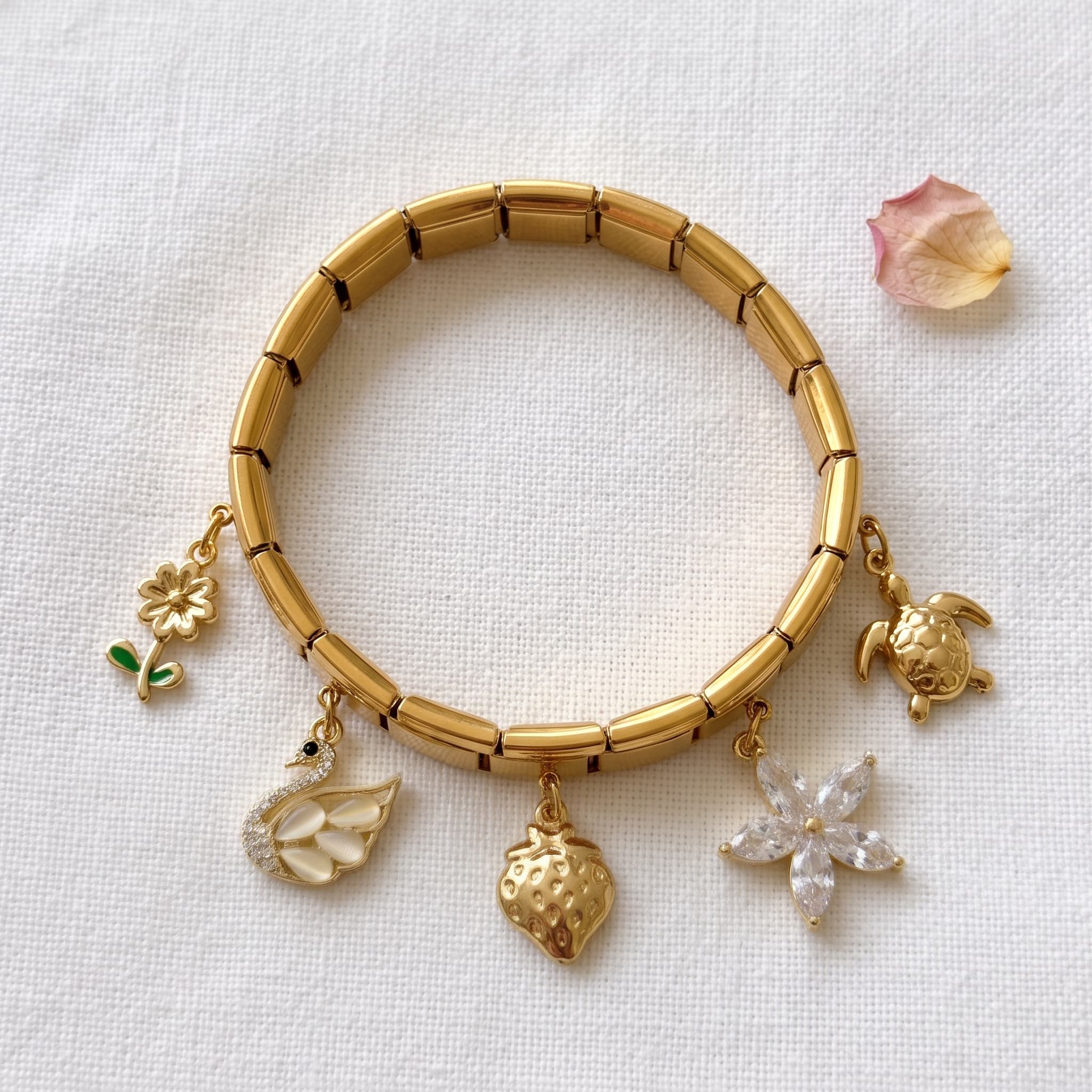 golden charm bracelet with motifs