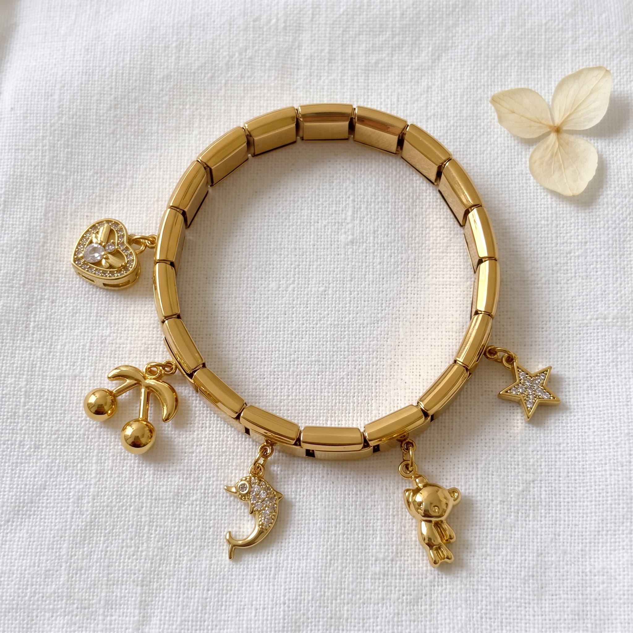 playful gold dolphin charm bracelet