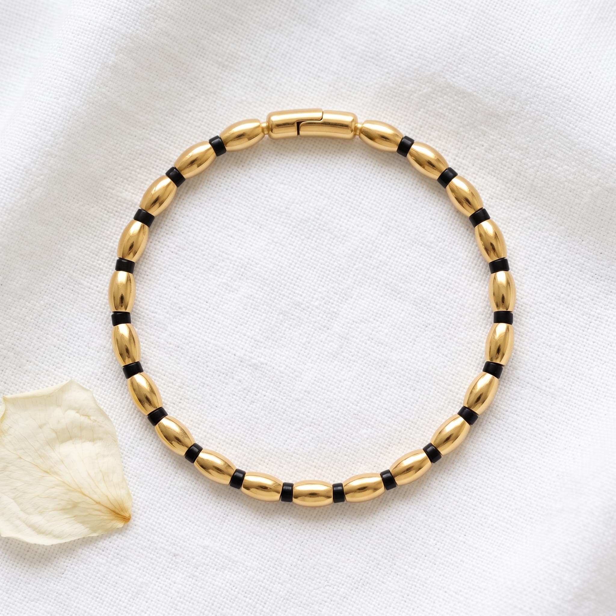 gold and black bead bracelet