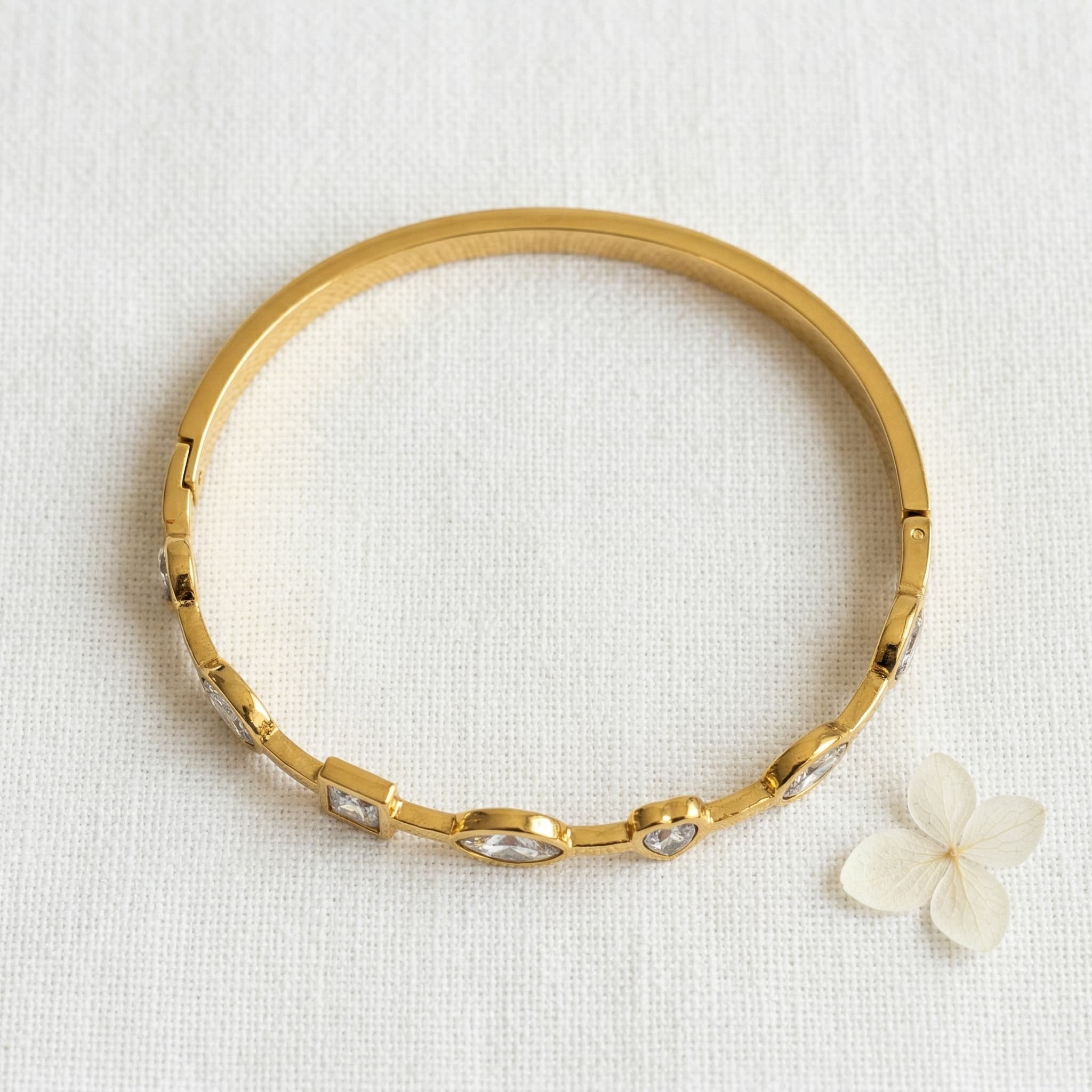 dainty stone studded gold bangle