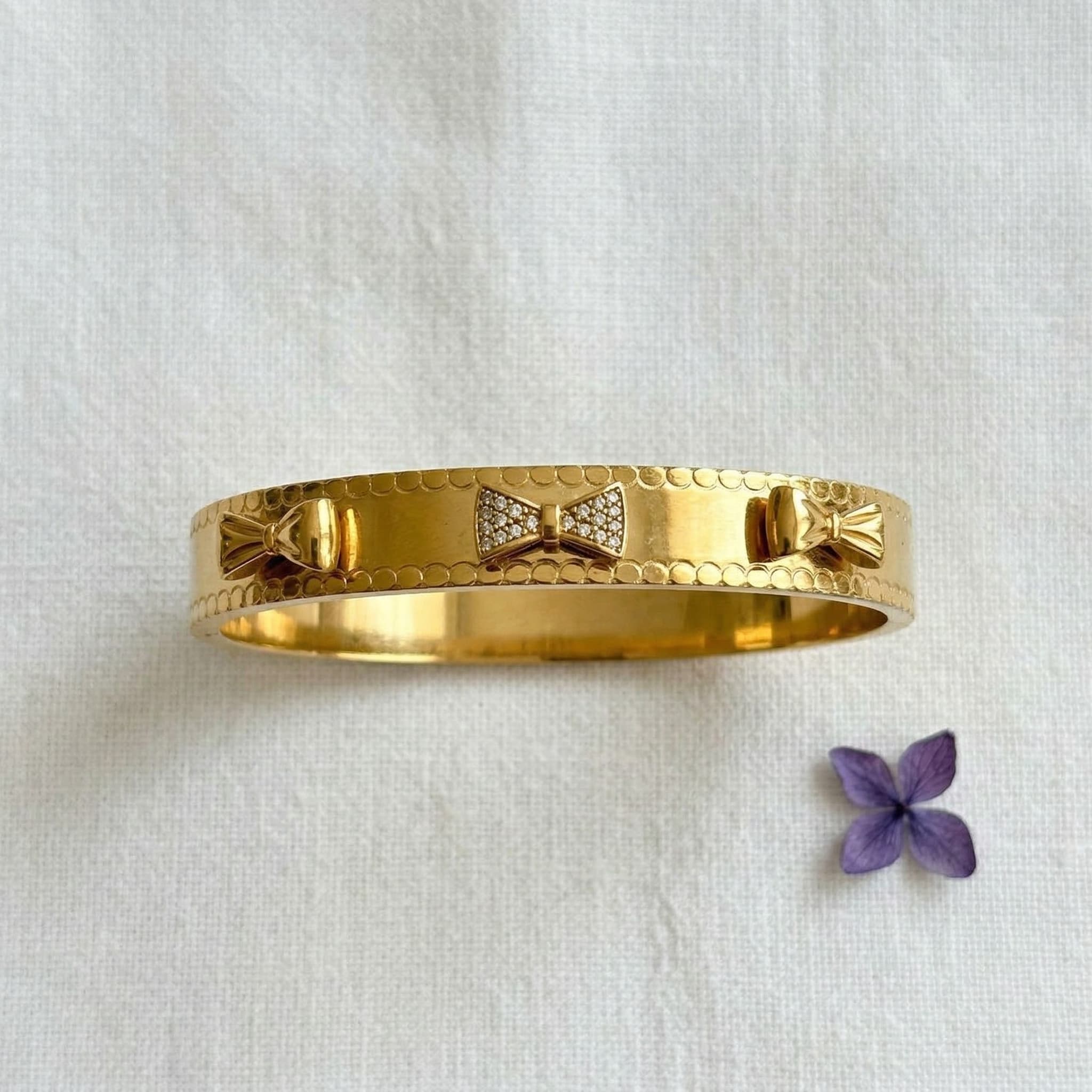 golden bow charm cuff