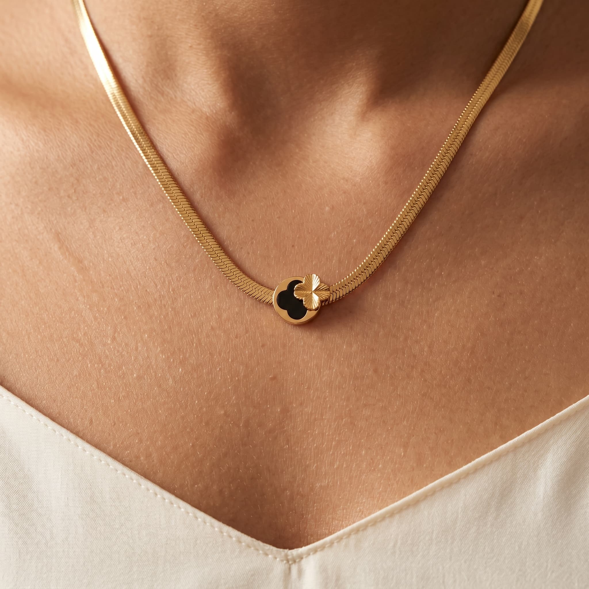 sleek herringbone black clover necklace
