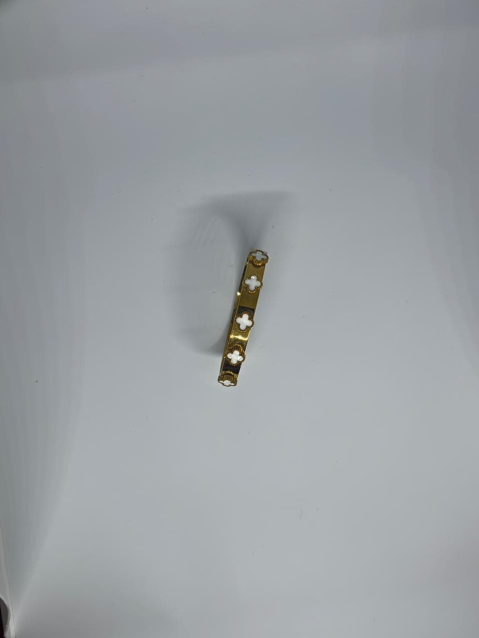 clover motif gold bangle