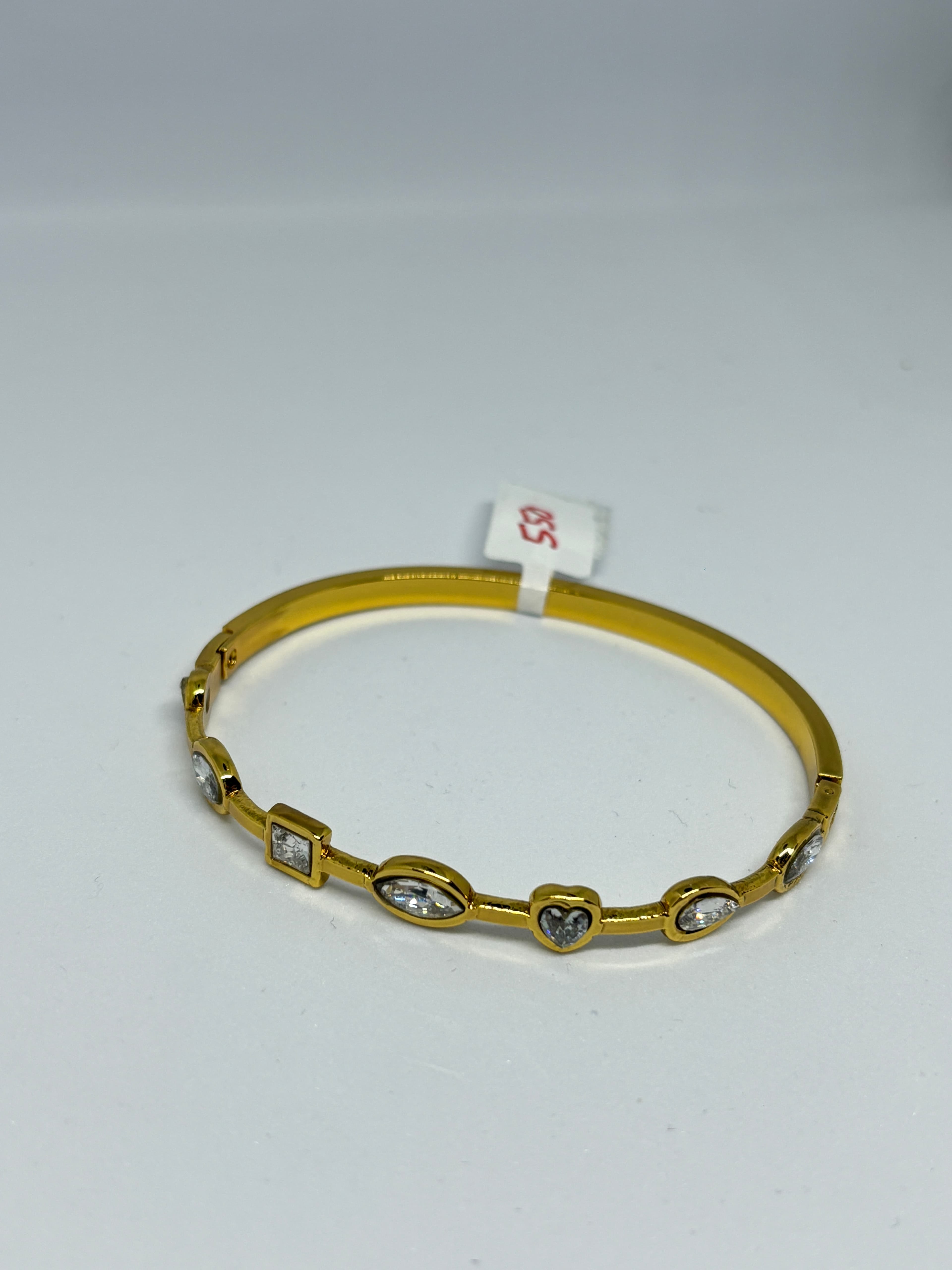 dainty stone studded gold bangle