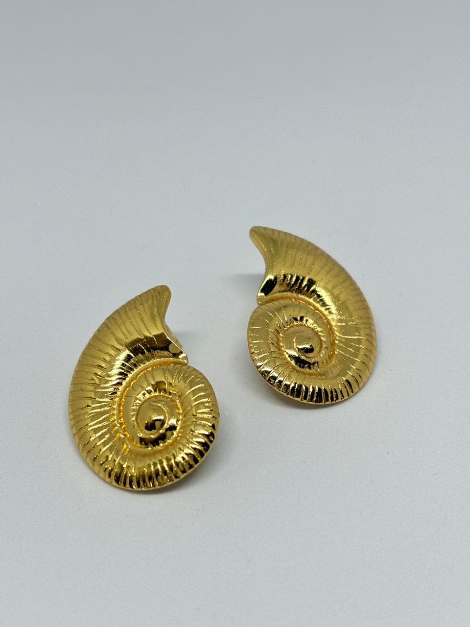 golden swirl shell studs