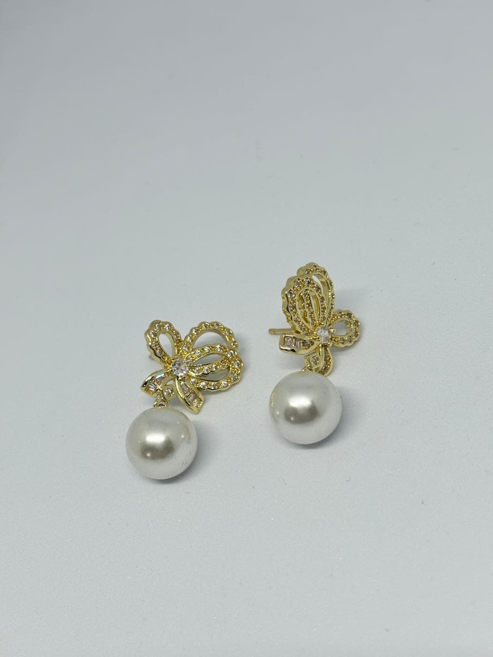 pearl and bow drop earrings