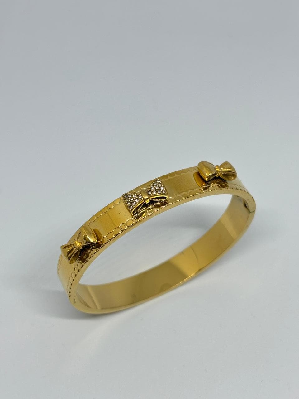 golden bow charm cuff
