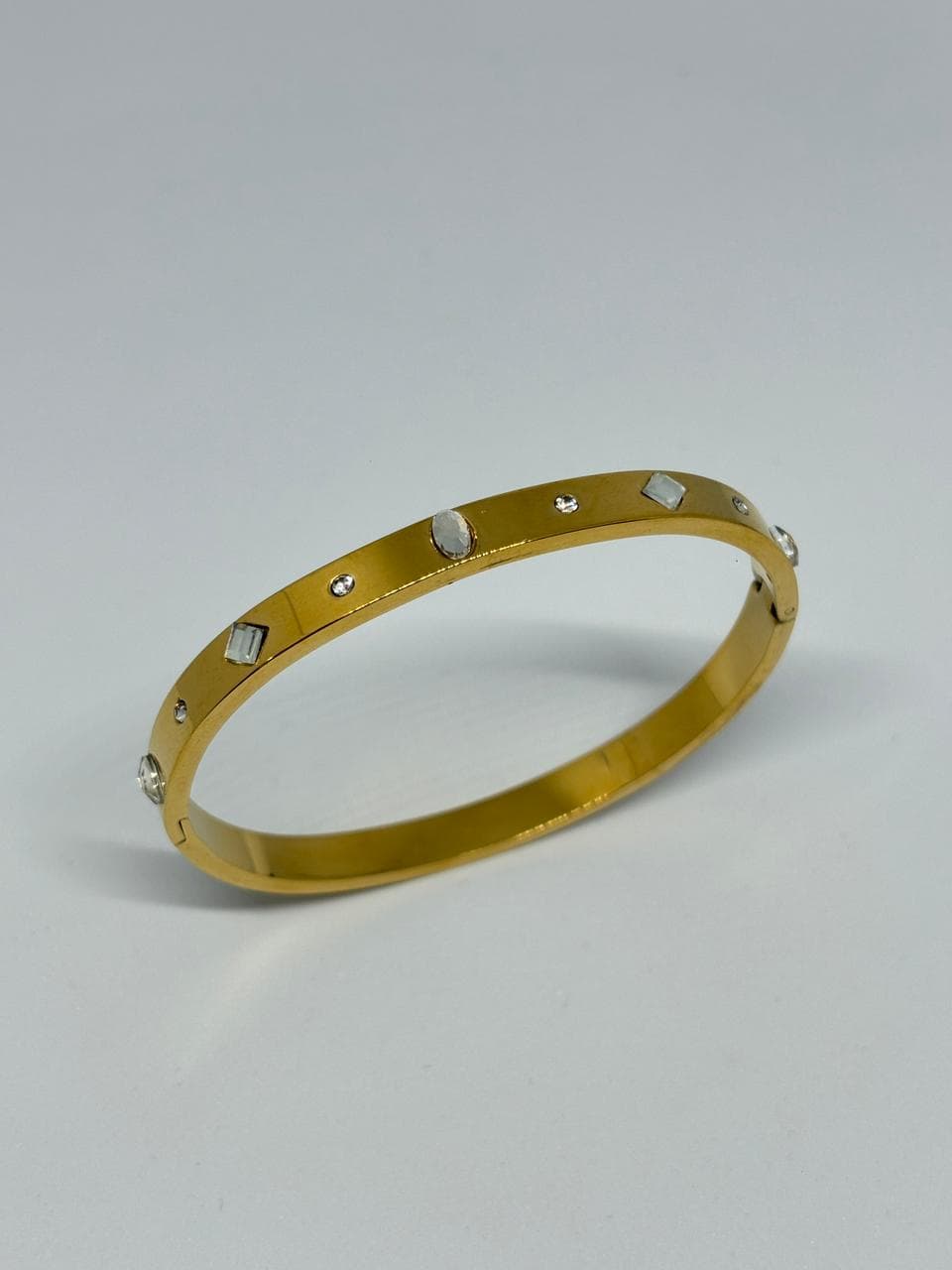 stone studded gold bangle