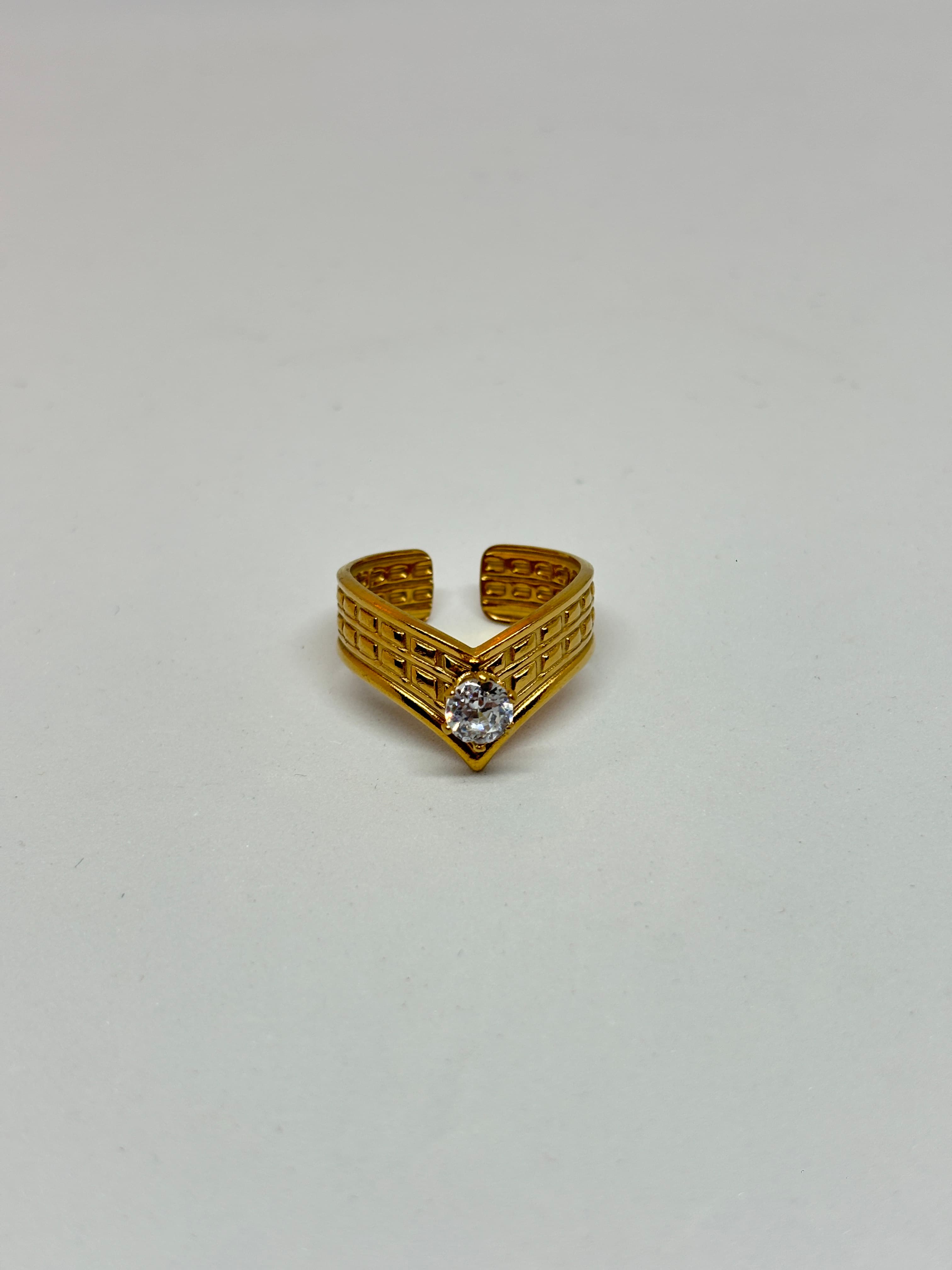 v-shaped golden stone ring