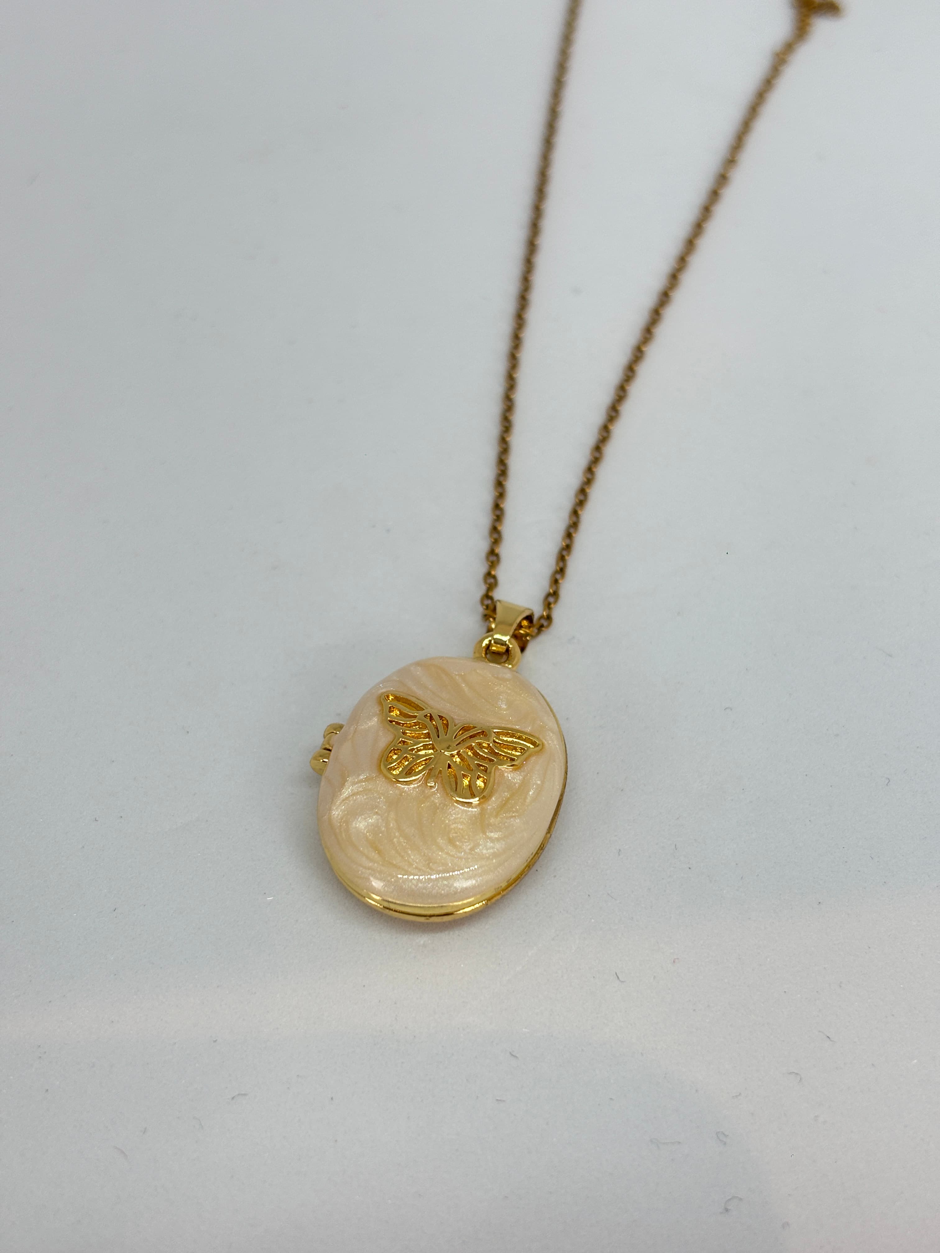 nude butterfly locket pendant