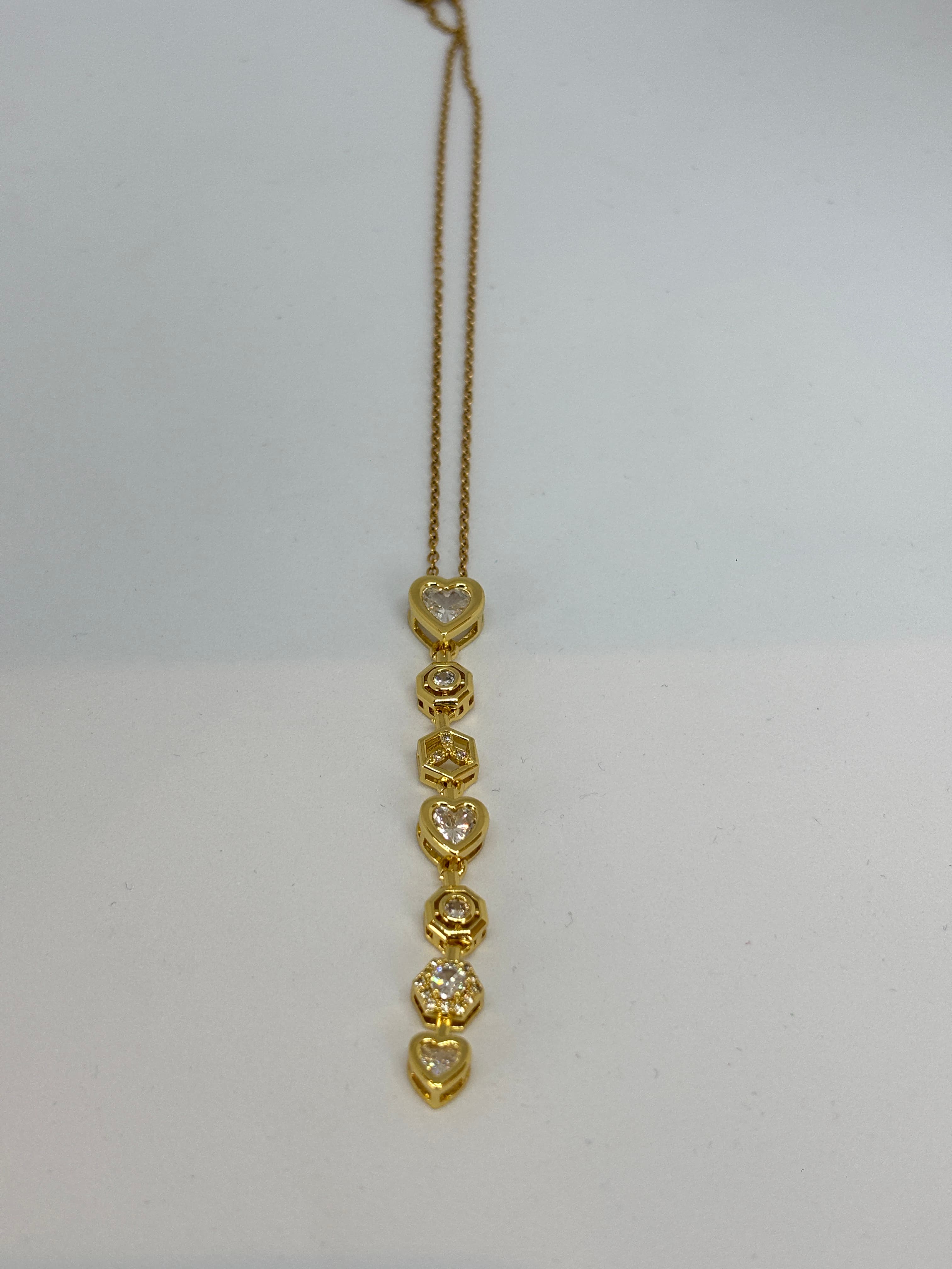 hearts and hexagons gold pendant
